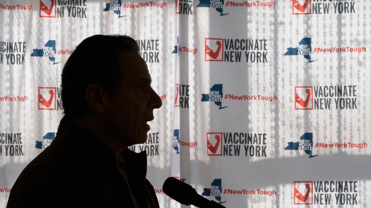 FILE - In this Saturday, Jan. 23, 2021 file photo, Gov. Andrew Cuomo speaks to reporters during a news conference at a COVID-19 pop-up vaccination site in the William Reid Apartments in the Brooklyn borough of New York. More than 9,000 recovering coronavirus patients in New York state were released from hospitals into nursing homes at the height of the pandemic under a controversial order that was scrapped amid criticisms it accelerated outbreaks, according to new records obtained by The Associated Press. (AP Photo/Mary Altaffer, Pool)