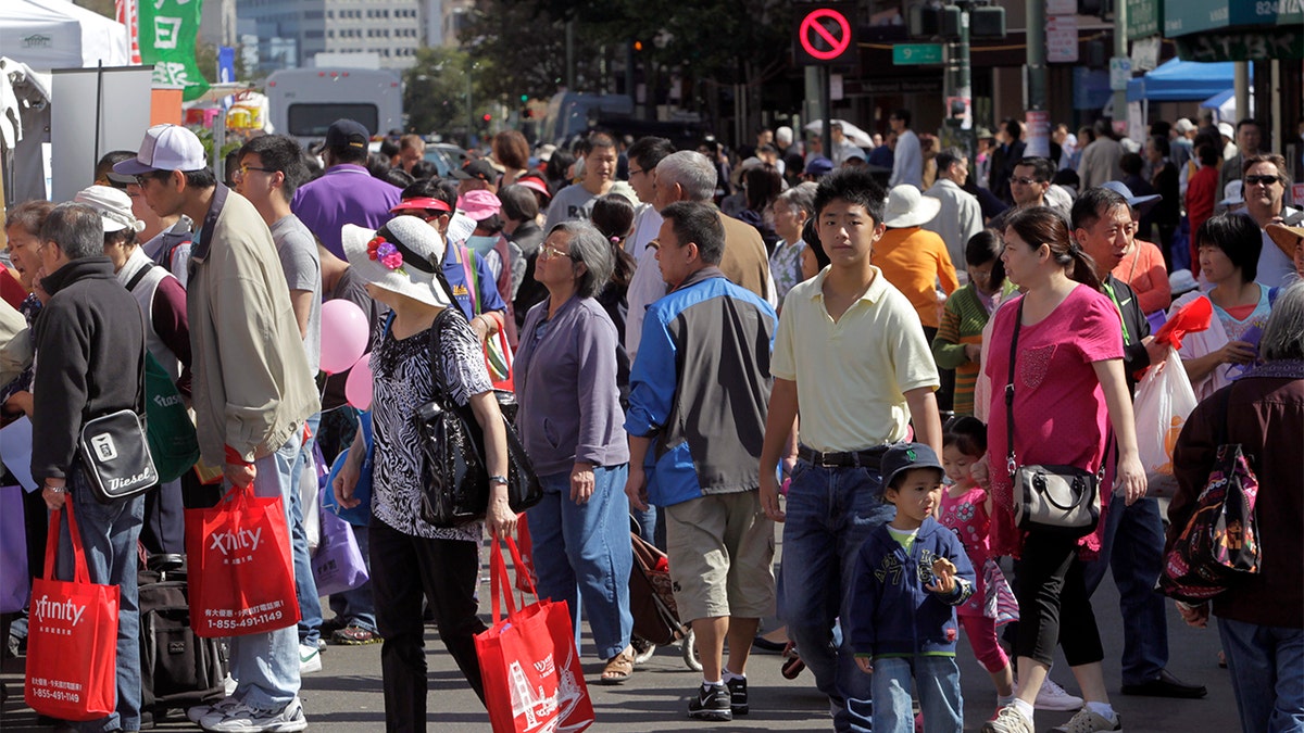 Thousands pack Franklin, Eighth and the surrounding streets to attend the 27th annual Chinatown StreetFest in Oakland, Calif. on Saturday, Aug. 23, 2014. 