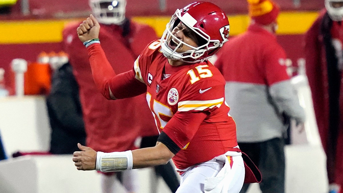 Kansas City Chiefs quarterback Patrick Mahomes celebrates after throwing a 5-yard touchdown pass to tight end Travis Kelce during the second half of the 2021 AFC championship game against the Buffalo Bills in Kansas City, Mo.