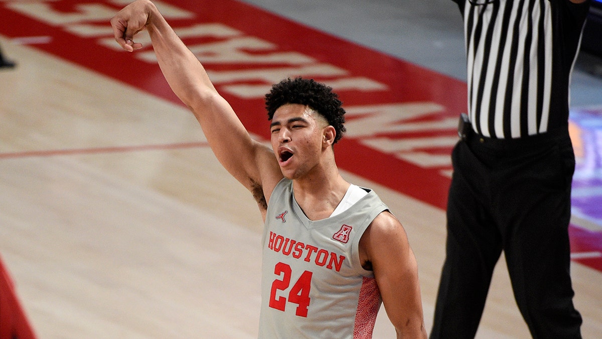 Houston guard Quentin Grimes (24) reacts after making a three point basket during the second half of an NCAA college basketball game against Western Kentucky, Thursday, Feb. 25, 2021, in Houston. (AP Photo/Eric Christian Smith)