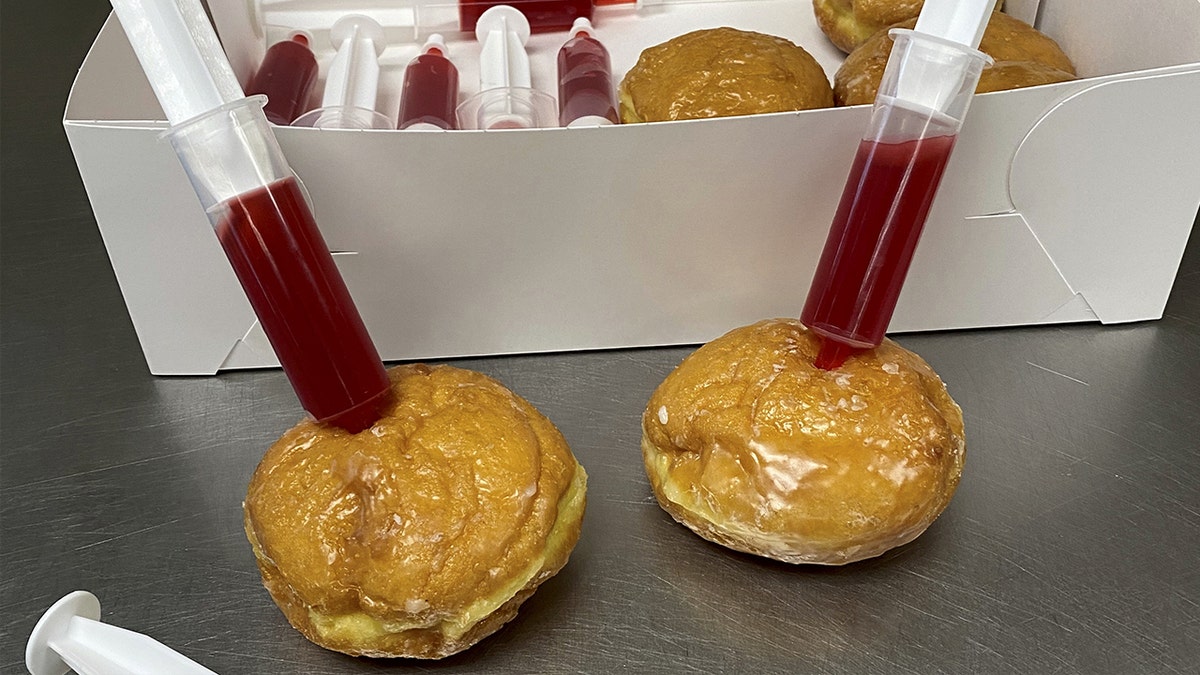 For a limited time, the sweet shop sold boxes of half a dozen glazed doughnuts packed with syringes full of raspberry jelly, to playfully "immunize" the treats at home.