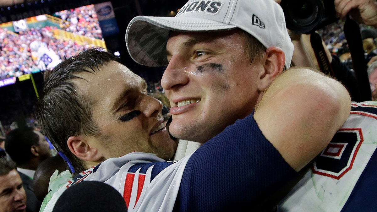 FILE - In this Feb. 1, 2015, file photo, New England Patriots quarterback Tom Brady, left, and Rob Gronkowski celebrate after they defeated the Seattle Seahawks in the NFL Super Bowl XLIX football game in Glendale, Ariz.  (AP Photo/Kathy Willens, File)