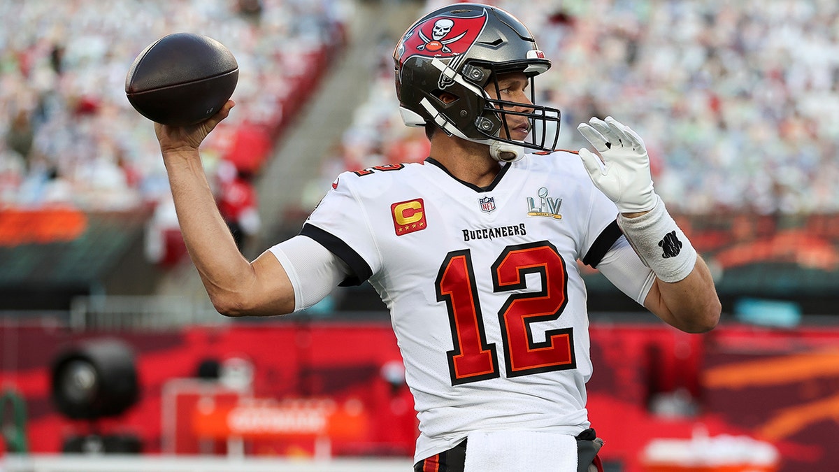 Tampa Bay Buccaneers quarterback Tom Brady throws the ball in warmups prior to the NFL Super Bowl 55 football game against the Kansas City Chiefs, Sunday, Feb. 7, 2021, in Tampa, Fla. (Ben Liebenberg via AP)