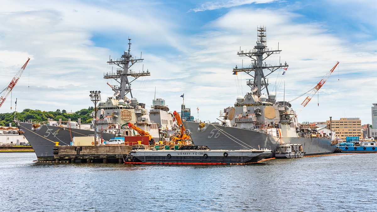 American Arleigh Burke-class destroyer USS John S. McCain DDG-56 and USS Curtis Wilbur DDG-54 of the United States Navy berthed in the Japanese Yokosuka naval base.