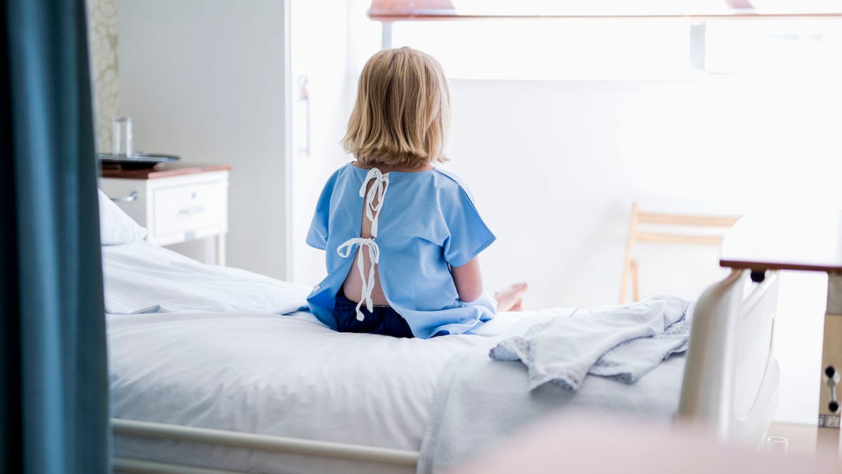 Child on hospital bed stock photo