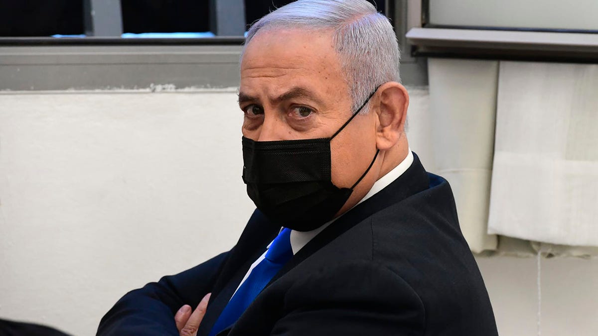 Israeli Prime Minister Benjamin Netanyahu looks on prior to a hearing at the district court in Jerusalem, Monday, Feb. 8, 2021. (AP Photo/Reuven Castro, Pool)