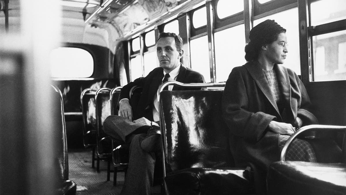 American civil rights activist Rosa Parks sits in the front of a bus in Montgomery, Alabama, after the Supreme Court ruled segregation illegal on the city bus system on Dec. 21, 1956.