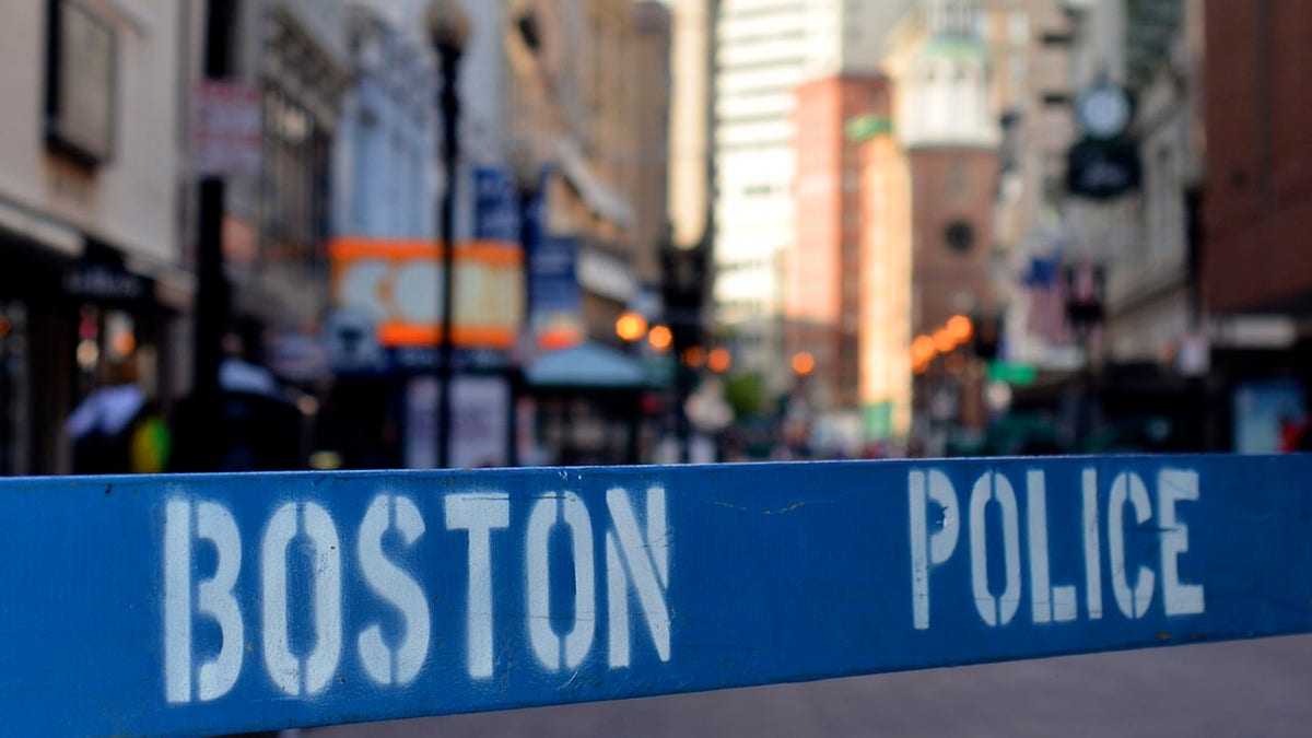 This file photo shows a police barricade at a crime scene in Boston. 