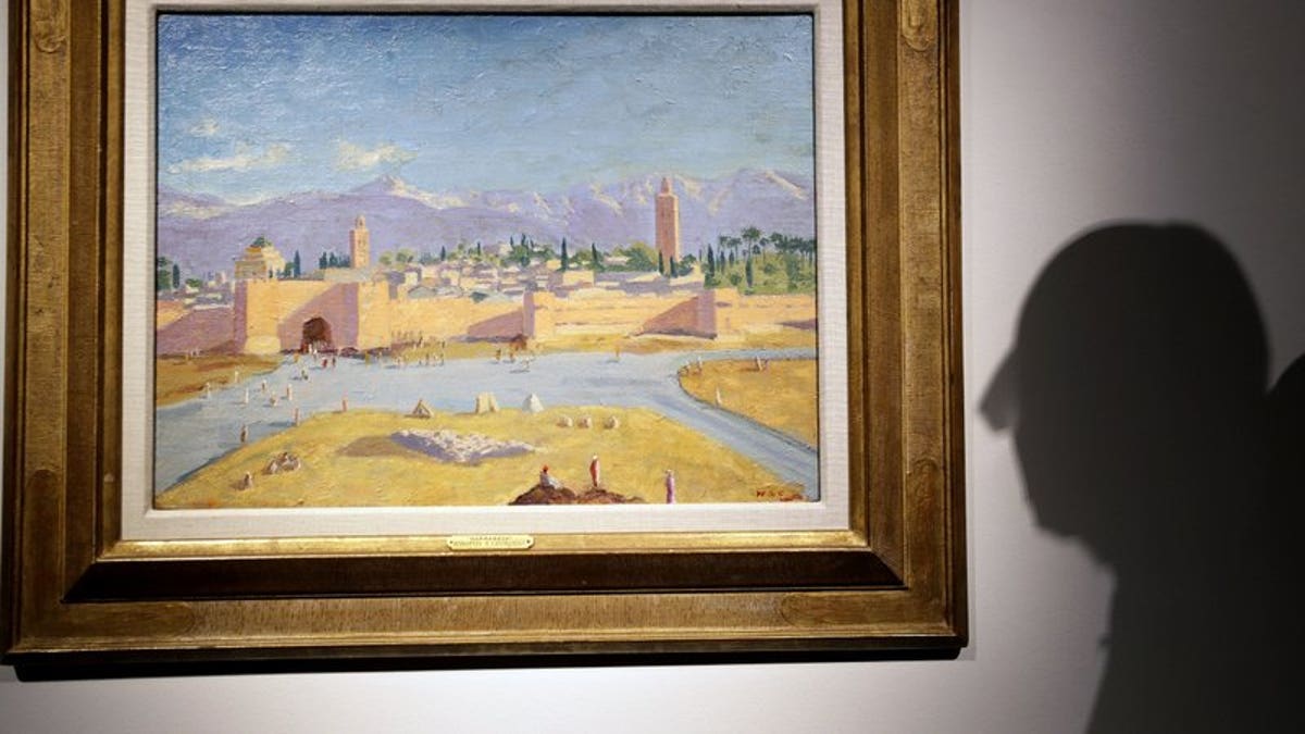 An oil on canvas painting by Sir Winston Churchill Painted in Jan. 1943 called 'Tower of the Koutoubia Mosque' is displayed at Christie's auction rooms in London, Friday, Jan. 29, 2021. The painting currently owned by Angelina Jolie, has an estimate of 1,500,000-2,500,000 UK pounds (2,056,489- 3,427,482 US Dollars) and will go up for sale in the Modern British Art Evening Sale at Christie's on March 1, 2021. (AP Photo/Kirsty Wigglesworth)