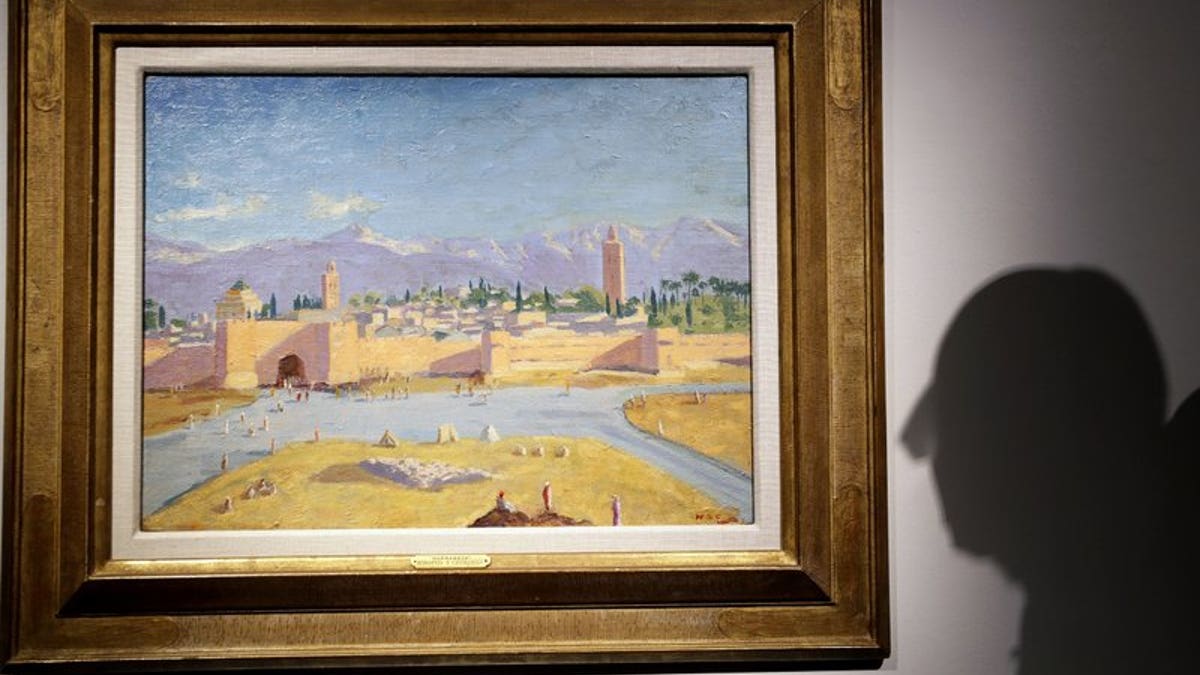 An oil on canvas painting by Sir Winston Churchill Painted in Jan. 1943 called 'Tower of the Koutoubia Mosque' is displayed at Christie's auction rooms in London, Friday, Jan. 29, 2021. The painting currently owned by Angelina Jolie, has an estimate of 1,500,000-2,500,000 UK pounds (2,056,489- 3,427,482 US Dollars) and will go up for sale in the Modern British Art Evening Sale at Christie's on March 1, 2021. (AP Photo/Kirsty Wigglesworth)