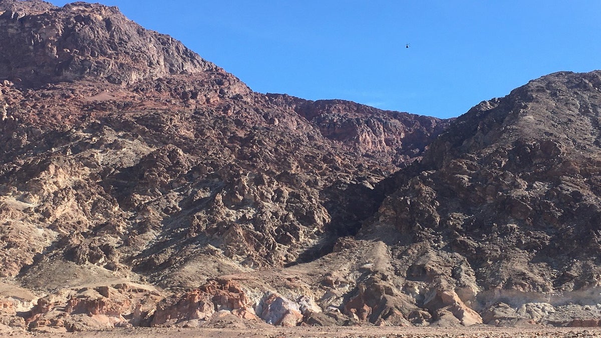 A helicopter from the California Highway Patrol approaches the accident site Saturday in Deimos Canyon. (NPS)