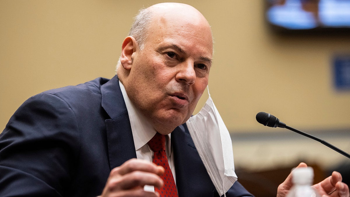 United States Postal Service Postmaster General Louis DeJoy speaks during a House Oversight and Reform Committee hearing on "Legislative Proposals to Put the Postal Service on Sustainable Financial Footing" on Capitol Hill, Wednesday, Feb. 24, 2021, in Washington. (Graeme Jennings/Pool via AP)