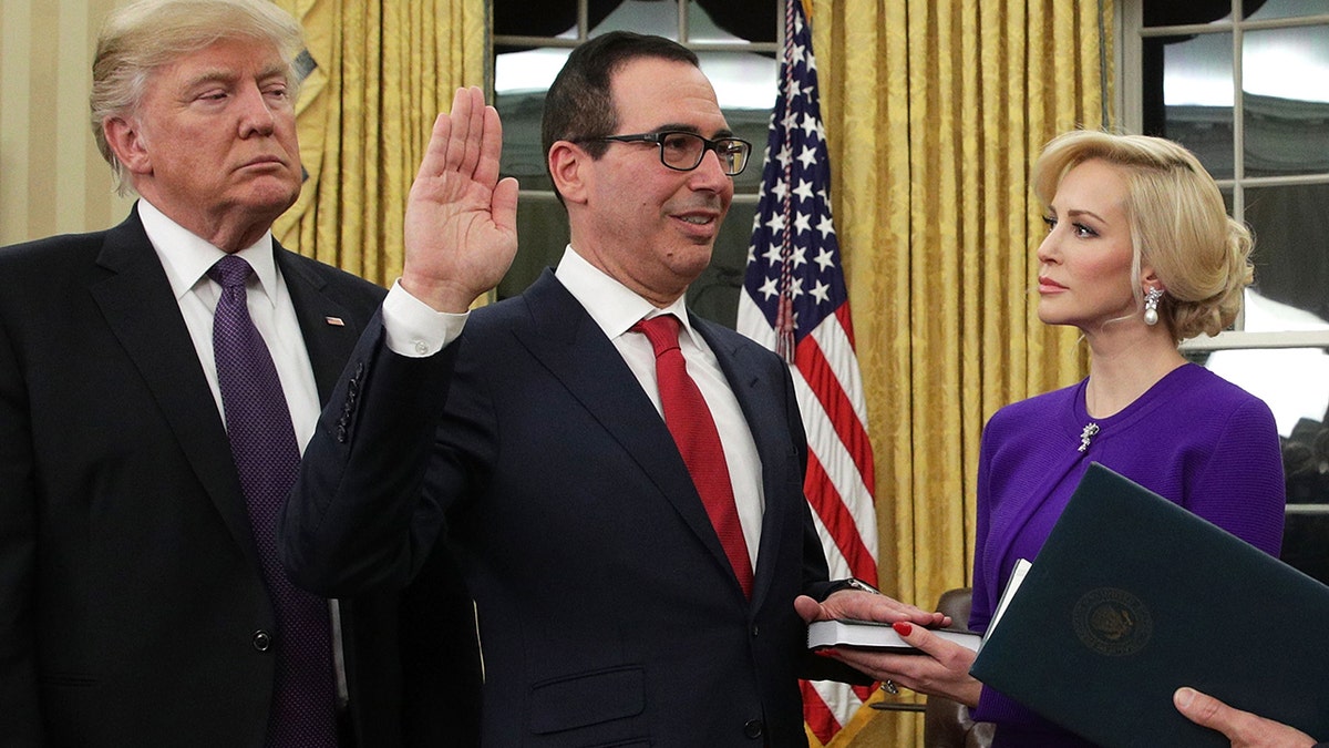 Louise Linton supports then-fiance Steven Mnuchin at his swearing-in ceremony with former President Donald Trump.