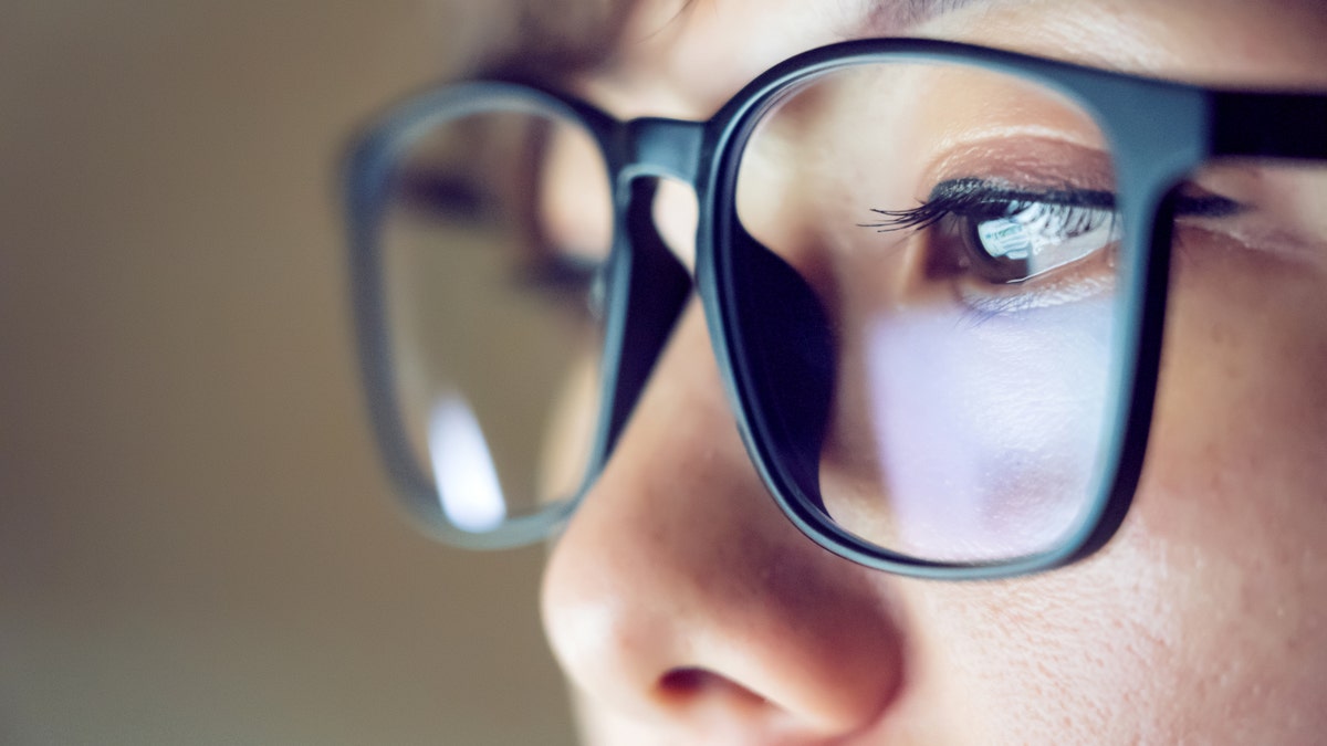 kid's screen reflected in glasses