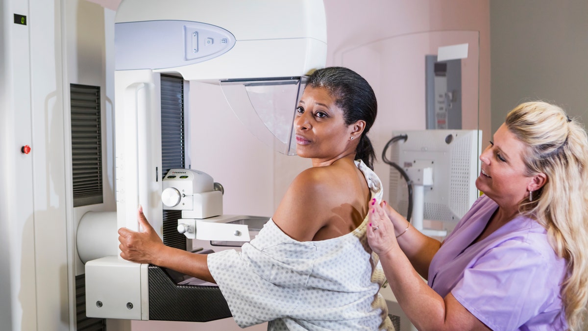 Woman getting mammogram