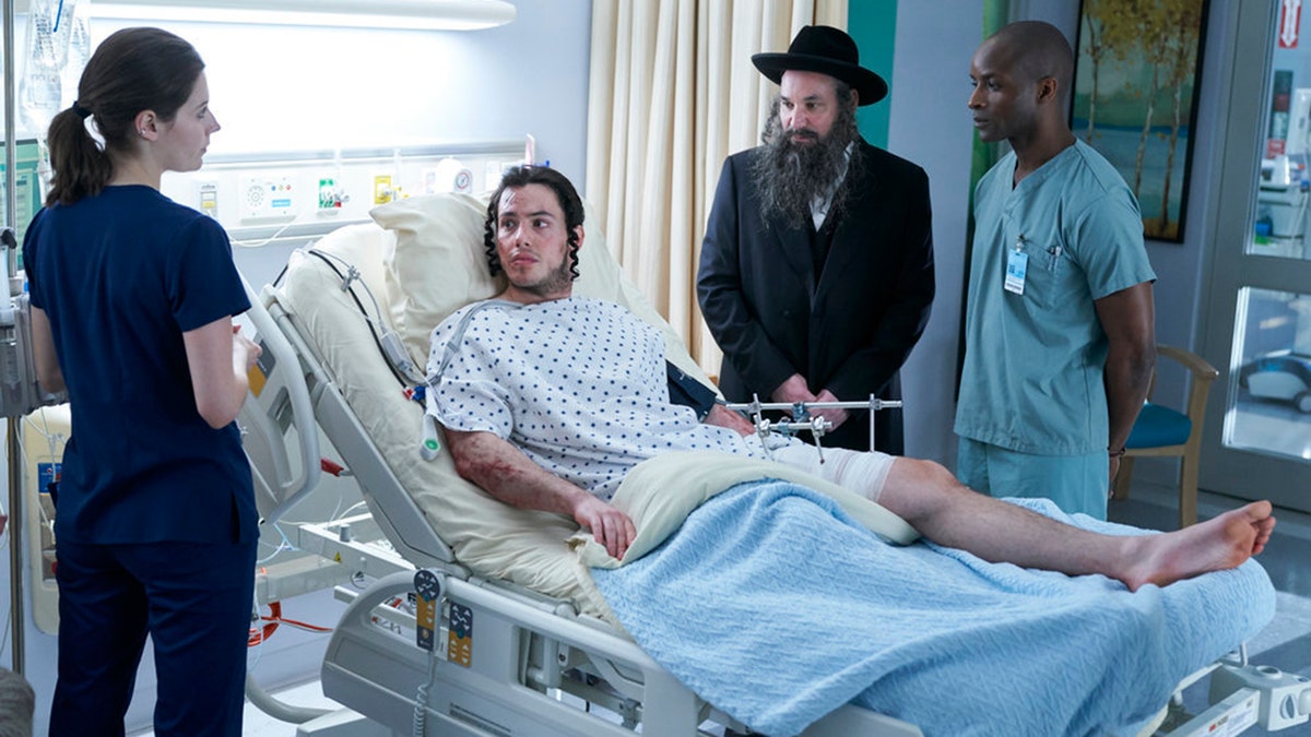 The scene in question aired on February 9. Pictured: (l-r) Natasha Calis as Ashley Collins, Sam Kantor as Ezriel, Alex Poch-Goldin as Toviyah, Dwight Ireland as Dr. McGowan.
