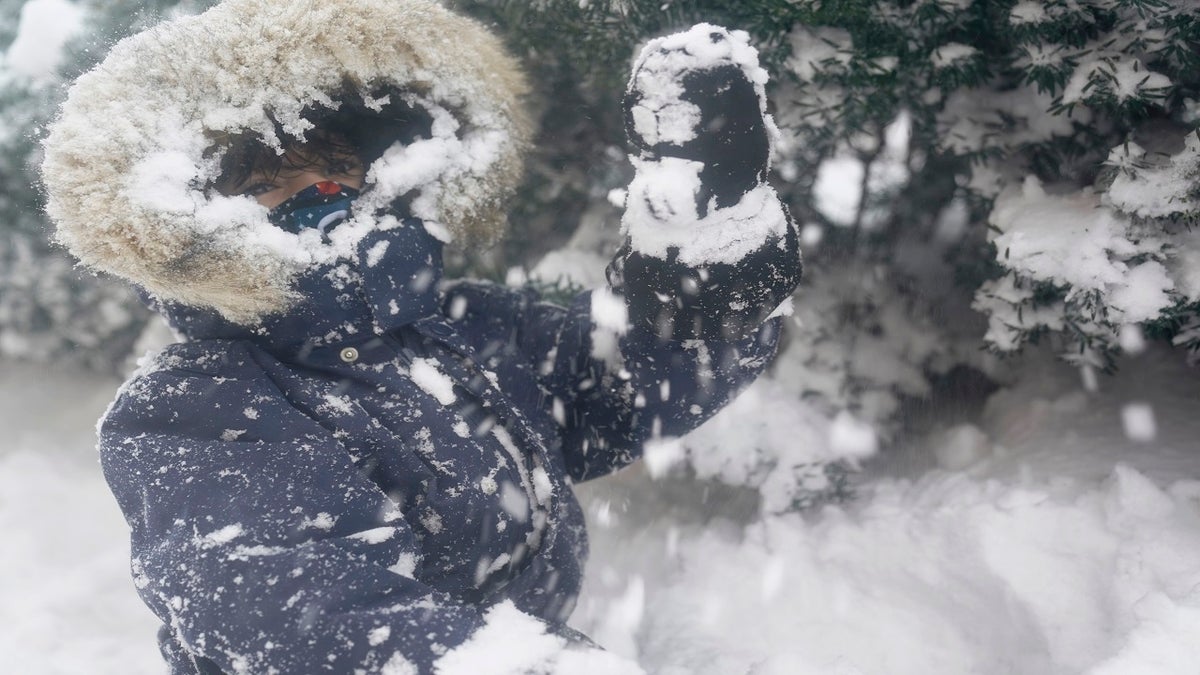 Arturo Diaz, 4, enjoys playing in a deep snow bank in Hoboken, N.J., on Monday. (AP)