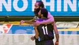 Brooklyn Nets guard James Harden (13) embraces guard Kyrie Irving (11) after Irving scored on a play during the second quarter of an NBA basketball game against the Orlando Magic, Thursday, Feb. 25, 2021, in New York. (AP Photo/Kathy Willens)