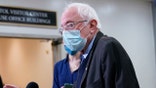 Sen. Bernie Sanders, I-Vt., talks with reporters on Capitol Hill in Washington, Friday, Feb. 12, 2021, on the fourth day of the second impeachment trial of former President Donald Trump. (AP Photo/Susan Walsh)