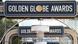 FILE - Event signage appears above the red carpet at the 77th annual Golden Globe Awards, Sunday, Jan. 5, 2020, in Beverly Hills, Calif. Nominations for the 78th annual Golden Globes will be announced on Wednesday, Feb. 2, 2021. (Photo by Jordan Strauss/Invision/AP, File)