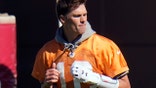Tampa Bay Buccaneers quarterback Tom Brady (12) runs with a elastic band around his legs during an NFL football workout Thursday, Jan. 28, 2021, in Tampa, Fla. The Buccaneers play the Kansas City Chiefs in Super Bowl LV on Feb. 7. (AP Photo/Chris O'Meara)
