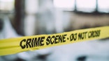 Detectives and forensics on murder crime scene collecting evidence