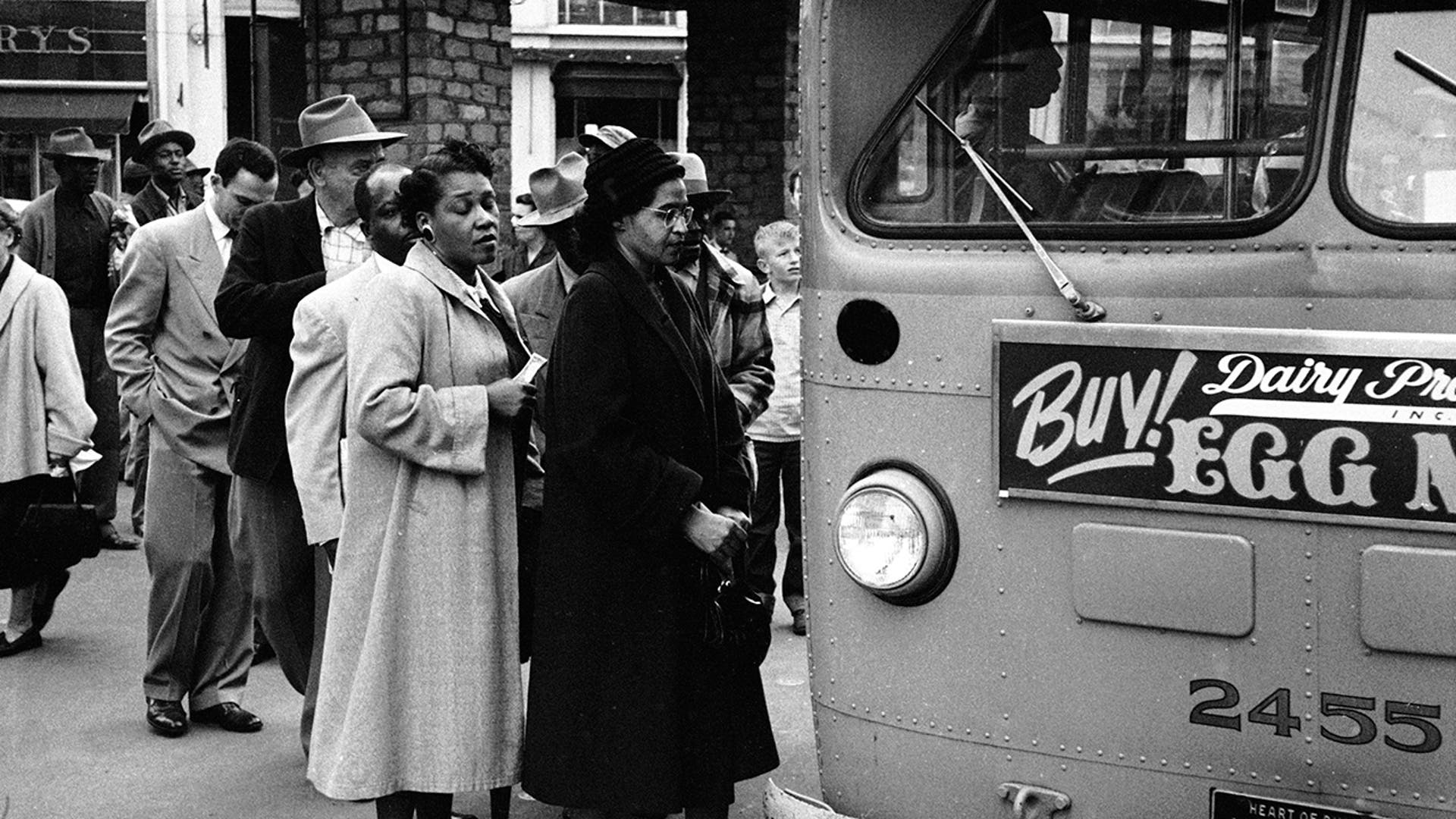 American civil rights activist Rosa Parks (center, in dark coat and hat) waits to board a bus at the end of the Montgomery bus boycott, Montgomery, Ala., Dec. 26, 1956.