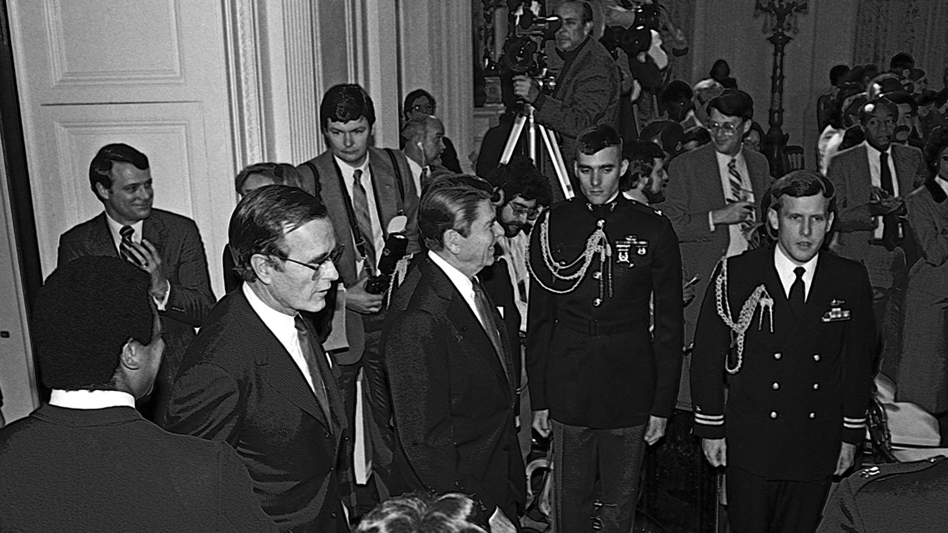 President Ronald Reagan and Vice President George H.W. Bush walk into the East Room of the White House to officiate in a Black History Month event, Washington D.C., Feb. 2, 1984.