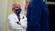 Dr. Fauci: It's 'possible' Americans may still be wearing face masks in 2022