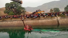 Bus drives off bridge into canal in central India; 40 dead