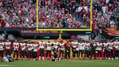 Chiefs, Bucs players lock arms during 'Lift Ev'ry Voice and Sing' rendition before Super Bowl LV kickoff