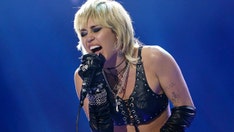 Miley Cyrus gets emotional during Super Bowl 2021 performance of 'Wrecking Ball'