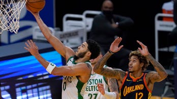 Tatum, Celtics hold off Curry and Warriors for 111-107 win