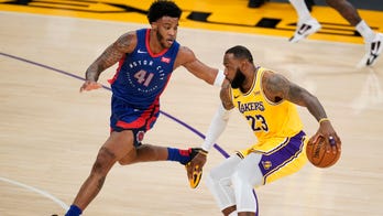 LeBron takes charge in 2nd OT, Lakers edge Pistons 135-129