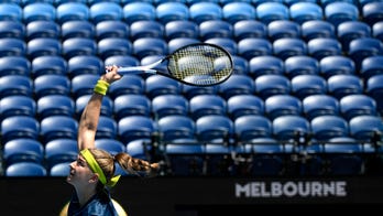 Australian Open goes quiet as lockdown keeps crowds away
