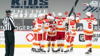 Gaudreau scores early in OT, Flames edge Canucks 4-3