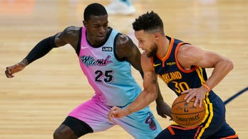 Curry and his supporting cast rally Warriors past Heat in OT