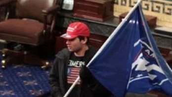 Capitol rioter accused of sitting in Pence's chair on Senate floor arrested by Feds
