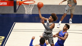 McBride, Sherman help No. 17 West Virginia top No. 23 Kansas