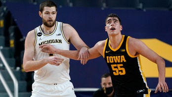 Dickinson impresses as No. 3 Michigan routs No. 9 Iowa 79-57