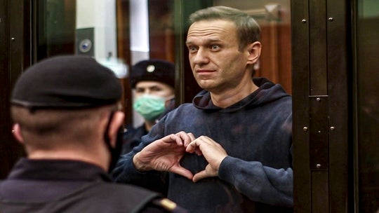 Russia blasts criticism of Putin critic Navalny's prison term as 1,400 more protesters arrested