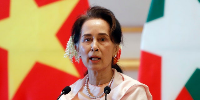 In this Dec. 17, 2019, file photo, Myanmar's leader Aung San Suu Kyi speaks during a joint press conference with Vietnam's Prime Minister Nguyen Xuan Phuc after their meeting at the Presidential Palace in Naypyitaw, Myanmar. Reports says Monday, Feb. 1, 2021 a military coup has taken place in Myanmar and Suu Kyi has been detained under house arrest. (AP Photo/Aung Shine Oo, File)