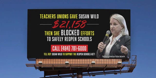 A mockup by the pro-Republican group American Action Network of the billboard that will be seen starting Thursday, Feb. 11, 2021, near a closed school in the district of Democratic Rep. Susan Wild of Pennsylvania.