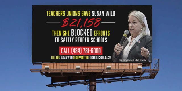 A mockup by the pro-Republican group American Action Network of the billboard that will be seen starting Thursday, Feb. 11, 2021, near a closed school in the district of Democratic Rep. Susan Wild of Pennsylvania.