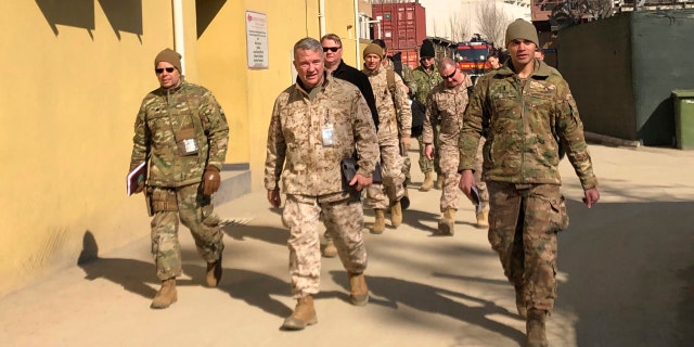 Marine Gen. Frank McKenzie, center, top U.S. commander for the Middle East, makes an unannounced visit in Kabul, Afghanistan. (AP Photos/Lolita Baldor, File)