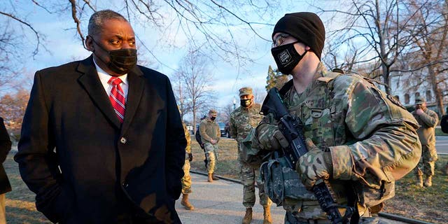 Secretary of Defense Lloyd Austin visits National Guard troops deployed at the U.S. Capitol and its perimeter, Friday, Jan. 29, 2021 on Capitol Hill in Washington. (AP Photo/Manuel Balce Ceneta, Pool)