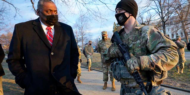 Secretary of Defense Lloyd Austin visits National Guard troops deployed at the U.S. Capitol and its perimeter, Friday, Jan. 29, 2021 on Capitol Hill in Washington. (AP Photo/Manuel Balce Ceneta, Pool)