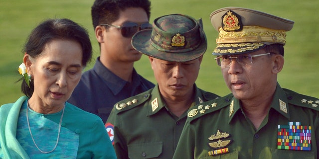 In this May 6, 2016, file photo, Aung San Suu Kyi, left, Burma's foreign minister, walks with senior General Min Aung Hlaing, right, Burma military's commander-in-chief, in Naypyitaw, Burma. (AP Photo/Aung Shine Oo, File)