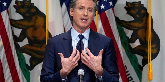 FILE - In this Jan. 8, 2021, file photo, California Gov. Gavin Newsom outlines his 2021-2022 state budget proposal during a news conference in Sacramento, Calif. About a year after the state's first coronavirus case, Newsom has gone from a governor widely hailed for his swift response to a leader facing criticism from all angles. (AP Photo/Rich Pedroncelli, Pool, File)