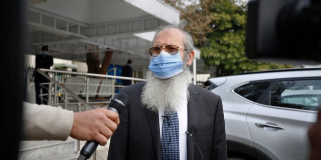 Ahmed Saeed Sheikh, father of British-born Pakistani Ahmed Omar Saeed Sheikh, talks to media following Daniel Pearl case hearing in the Supreme Court, in Islamabad, Pakistan, Tuesday, Feb. 2, 2021. Pakistan's Supreme Court on Tuesday ordered the Pakistani-British man acquitted of the 2002 gruesome beheading of American journalist Daniel Pearl off 'death row' and moved to a so-called government 'safe-house'. (AP Photo/Anjum Naveed)